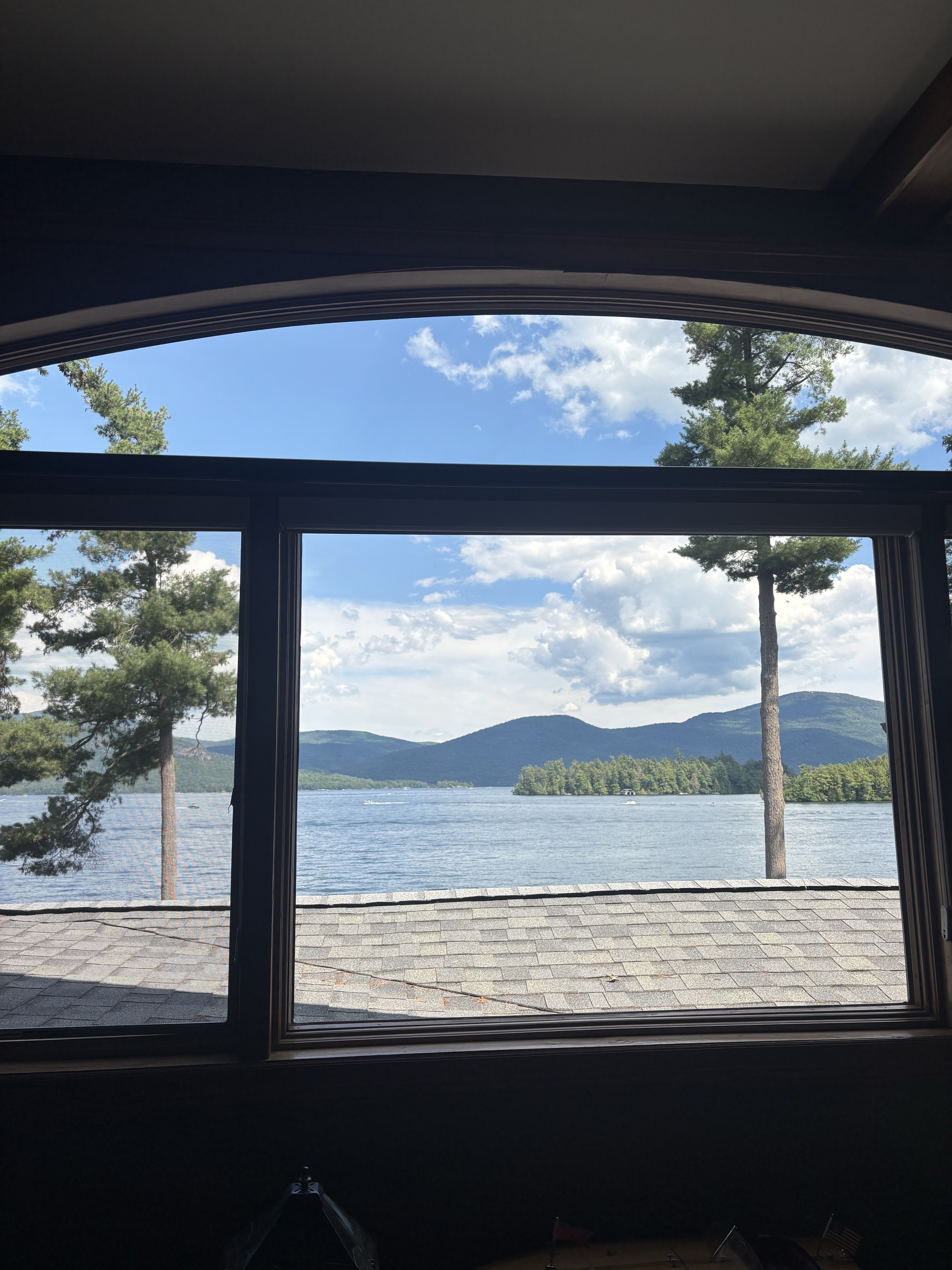 Crystal clear window with mountain lake view after professional cleaning